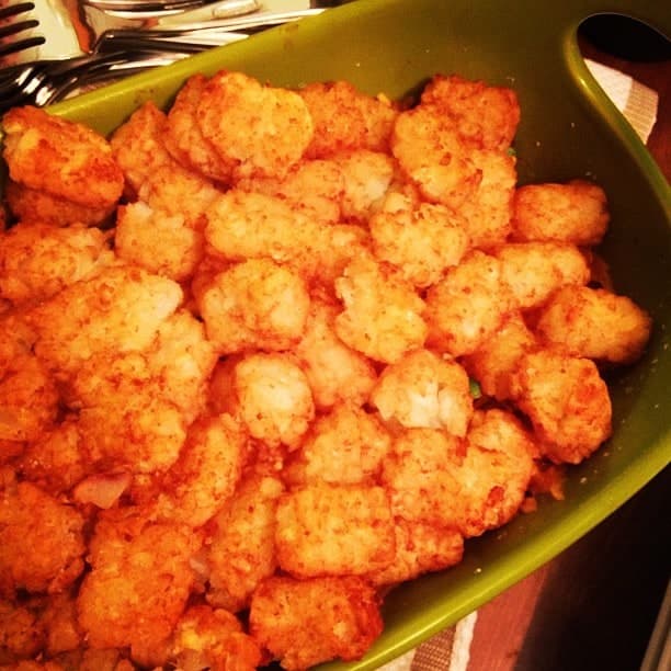Casserole dish topped with golden tater tots.
