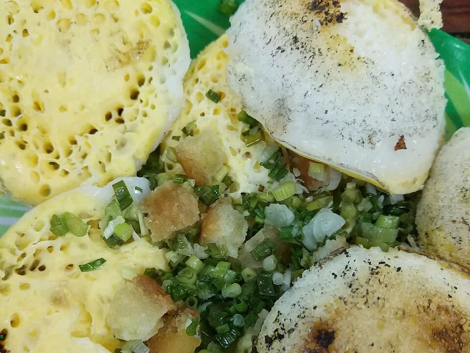 Small round griddled rice cakes with scallion oil and crisp edges.